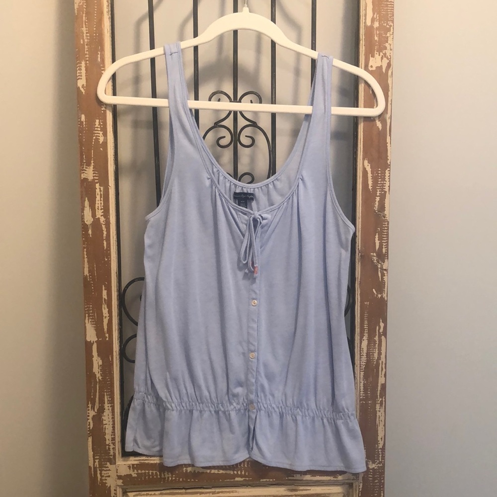 Women’s sleeveless top. Size medium.  Color is a light blue.